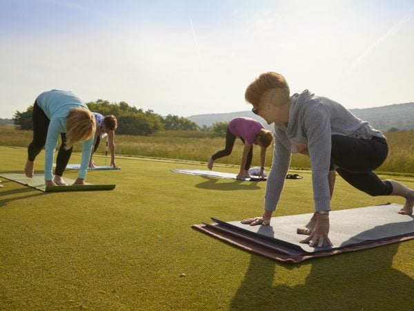 a group of people doing yoga