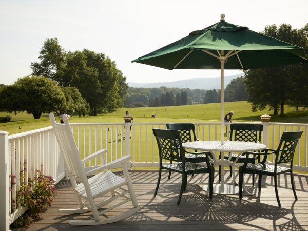 a table and chairs on a deck