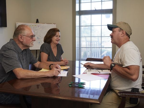 New community members discuss their home with the builder