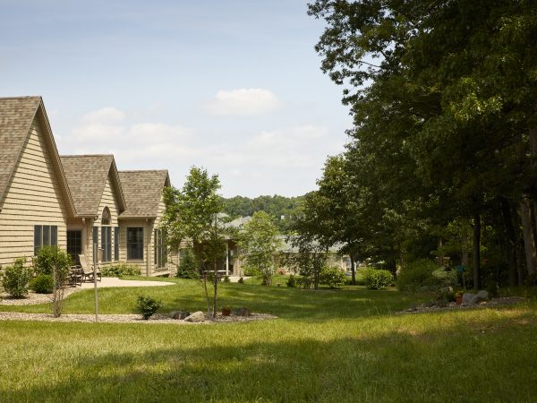 a house with trees and grass