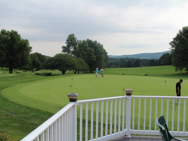 a group of people playing golf