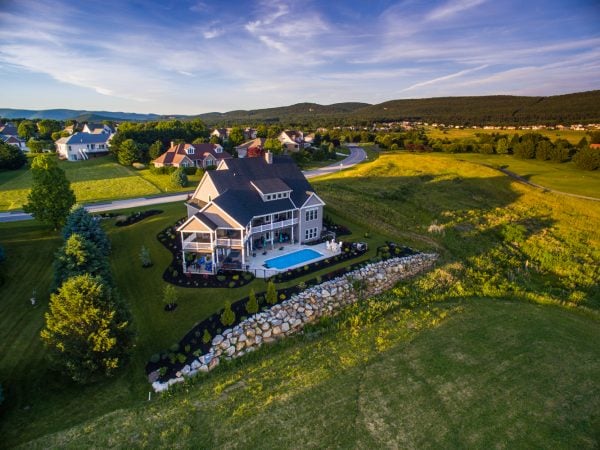 a house with a pool in the front