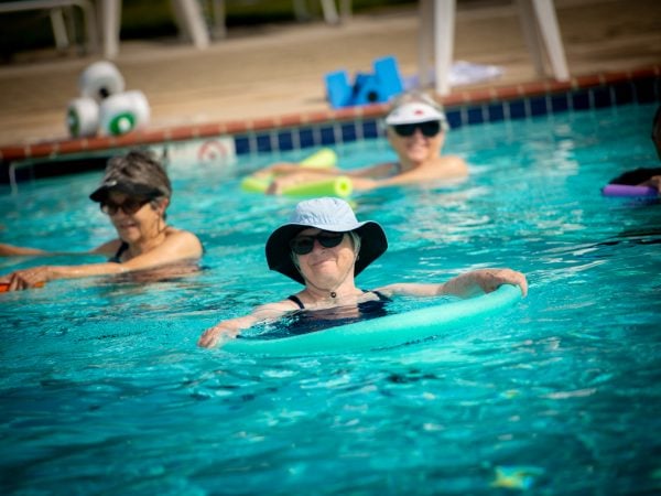 a group of people in a pool