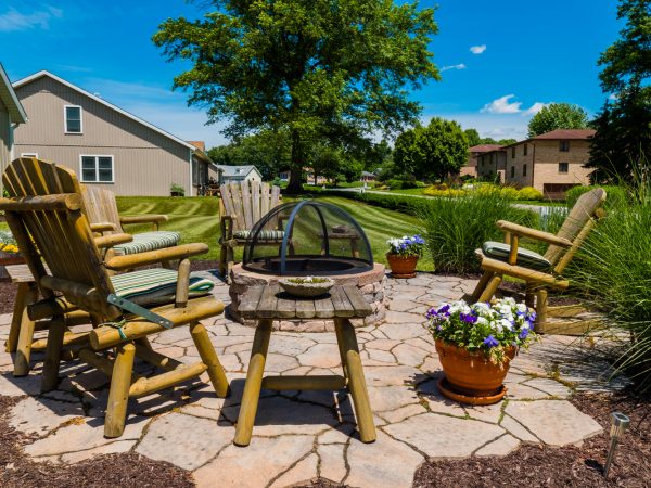 a patio with chairs and a table