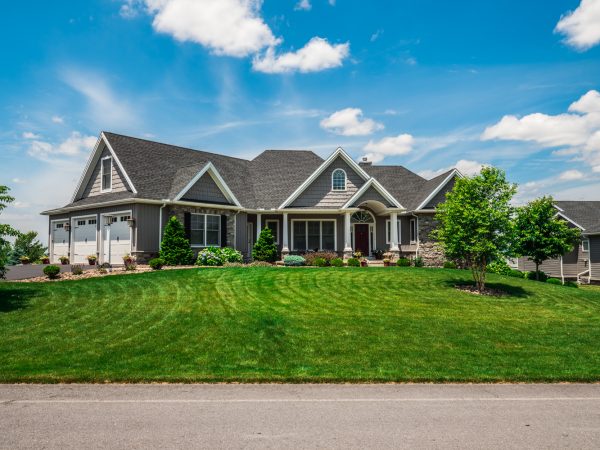 a house with a lawn in front of it