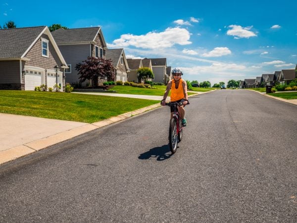 a person riding a bicycle on a street