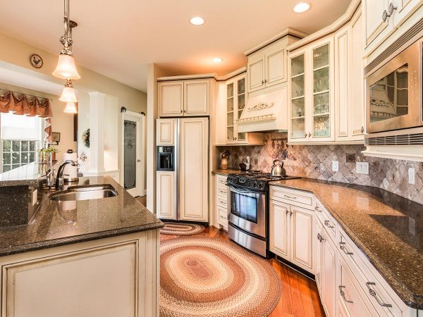 a kitchen with white cabinets