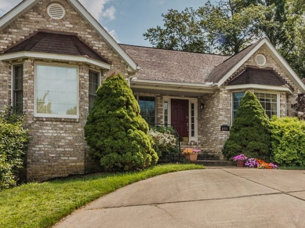 a house with a driveway and a large front yard