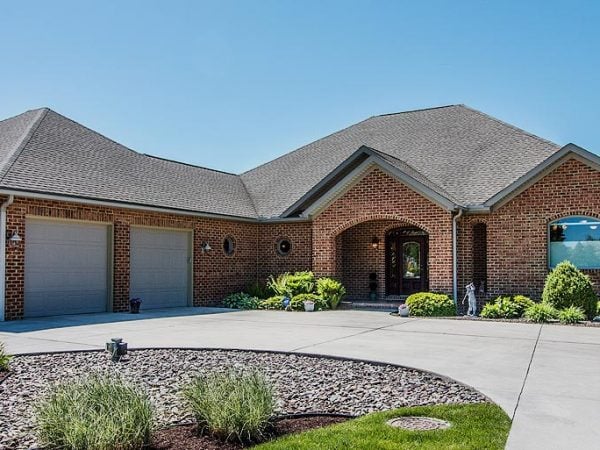 a building with a stone driveway